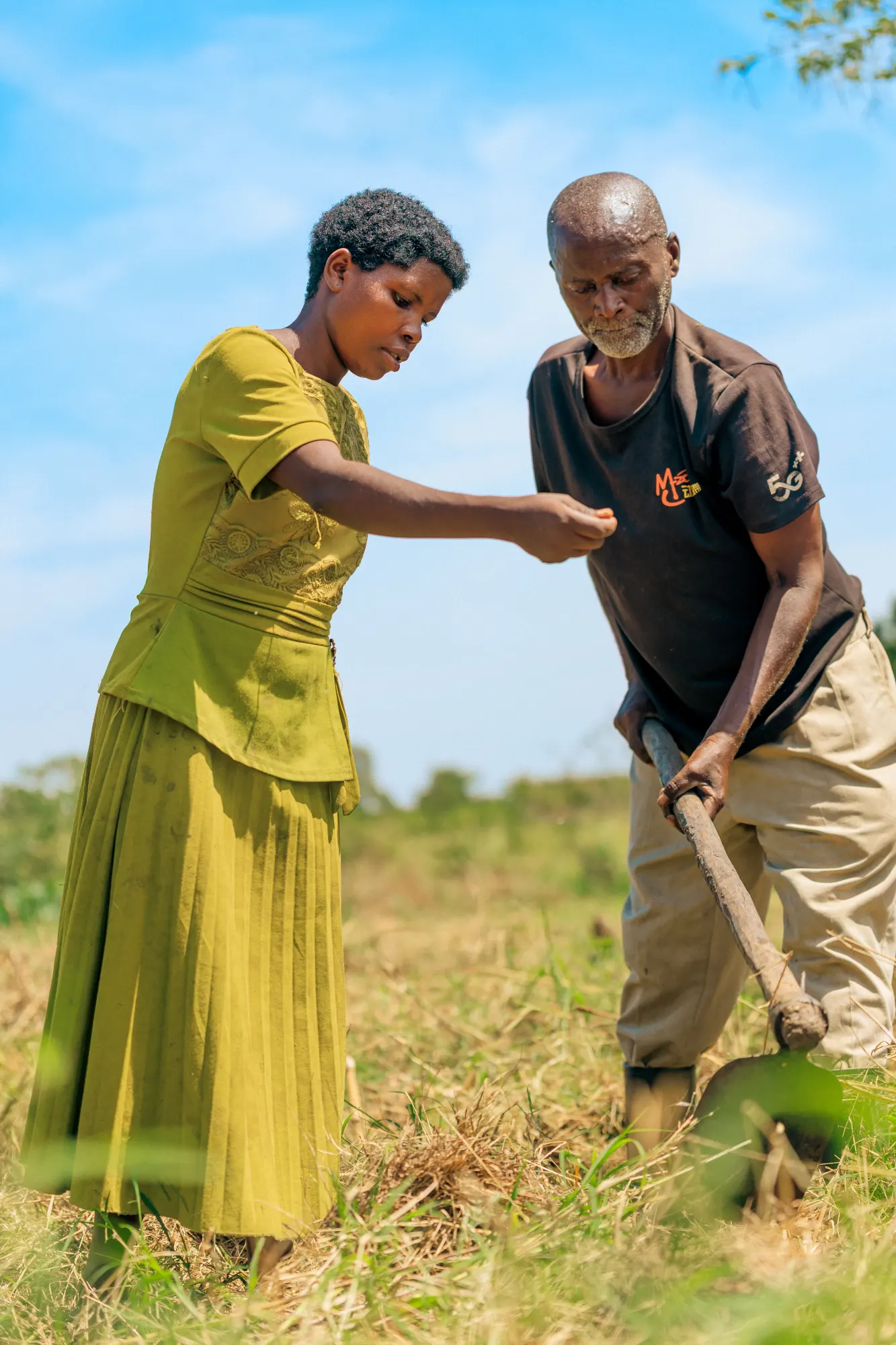 Two generations working the same field