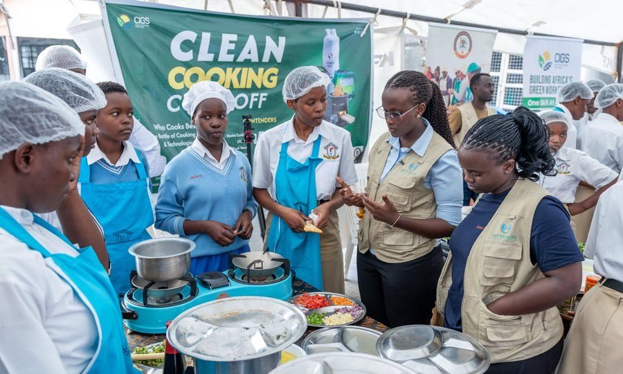 BetterLife team members with students at a clean cooking cook-off