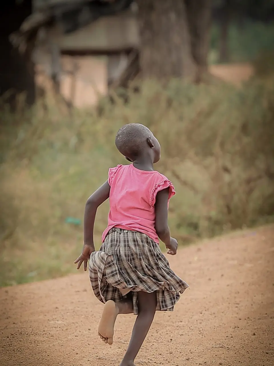 A girl running along a path