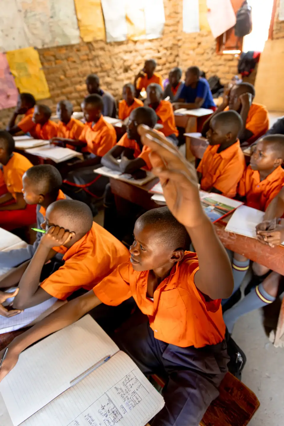 Pupils raising their hands in a school climate club