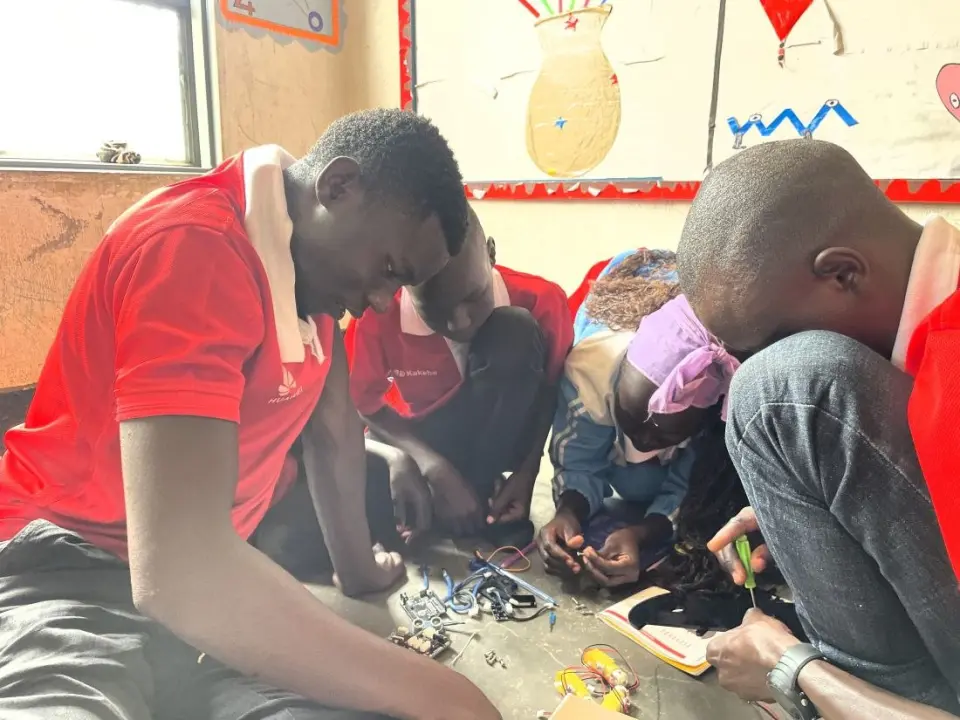 Tech Camp participants building a robotics prototype