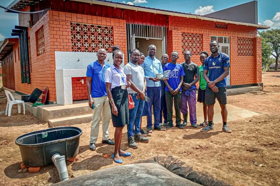 A group at a tubular biogas installation during training